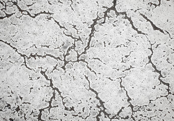Grunge cracked texture of an old floor. Background of damaged stone