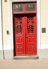 Fototapeta na wymiar red door in the city