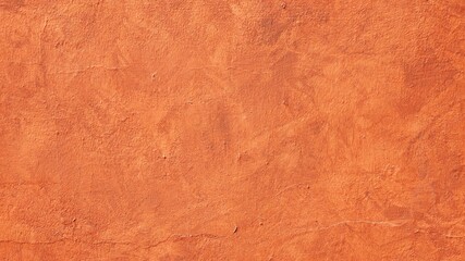 Orange plastered wall as a texture with copy space