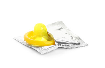Unpacked yellow condom isolated on white. Safe sex