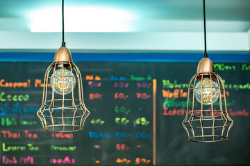 Fototapeta na wymiar Ceiling lamp vintage with coffee shop background