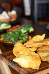 Traditional Romania, Ukrainian, Russian and Tatar food cheburek with meat and spring onion.