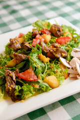 Salad with beef, tomatoes, fresh lettuce salad and arugula, raw mushrooms and great dressing from dijon mustard.
