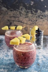 Blueberry pineapple smoothie with fruit skewers