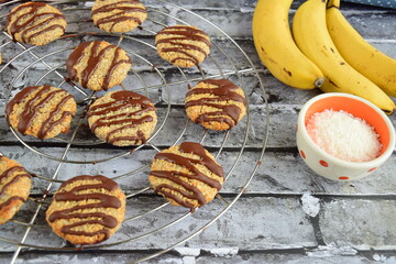 Banana coconut cookies drizzled with melted chocolate
