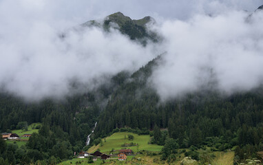 Clouds over the forest of the waterfall
