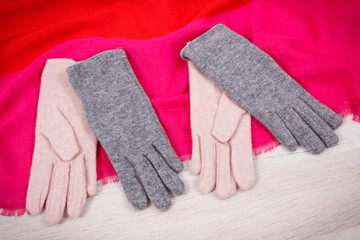 Warm womanly gloves and shawl for using in autumn or winter