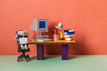 Robot office manager in thought. A toy retro office with a table, books, a personal computer, a...