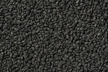 food background of kalonji seeds, top view