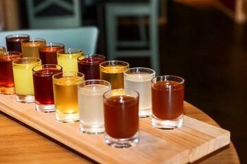 Selection of alcoholic drinks. Set of liqueur tinctures, cognac, whiskey in shot glasses.