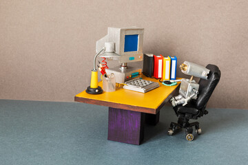 Robot office manager, retro style workplace. Old table vintage computer, desk lamp and books....
