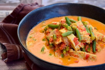 Indonesian tempeh and green bean cooked in spices and coconut milk. 