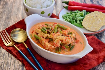Sayur tempe buncis. Tempeh and green bean cooked in spices and coconut milk. Indonesian food. Served with rice