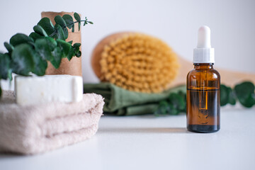 Dark glass bottle with squalane, serum, essential oil, cosmetic among spa care products. Natural organic cosmetics, eco or bio concept