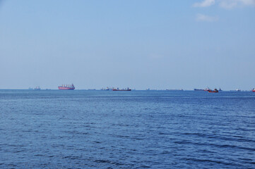 Panoramic view of the Bosphorus Strait with ships in the roads. Calm sea on a summer day. Istanbul.