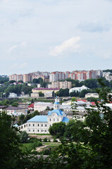 Fototapeta na wymiar Panoramic view of houses in Smolensk. A view from a height of the church and the multi-storey residential area.