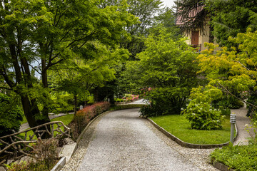 View of a Front Yard of a Traditional Old House in Como Lake