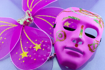 A festive,Beautiful mardi gras or carnival mask on beautiful colorful paper background