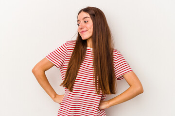 Young caucasian woman isolated on white background dreaming of achieving goals and purposes