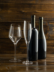 wine glasses with beveled edges on dark wooden background