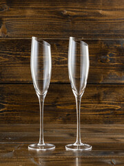 wine glasses with beveled edges on dark wooden background