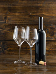 wine glasses with beveled edges on dark wooden background