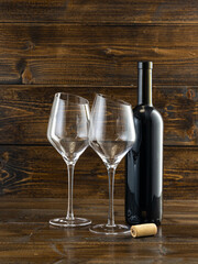 wine glasses with beveled edges on dark wooden background