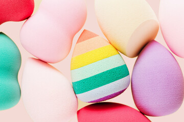 Colorful cosmetic beauty sponges different form Green, violet, rainbow colored makeup tools for tone cream