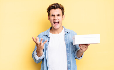 looking angry, annoyed and frustrated screaming wtf or what’s wrong with you. white box concept