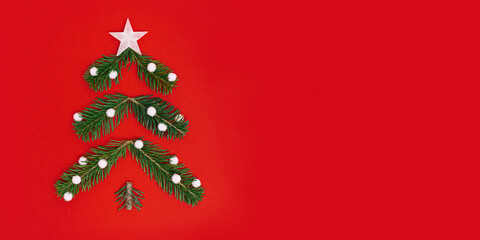 Creative Christmas pattern with green Christmas tree  from pine branches and snow, New Year composition. Minimal layout.