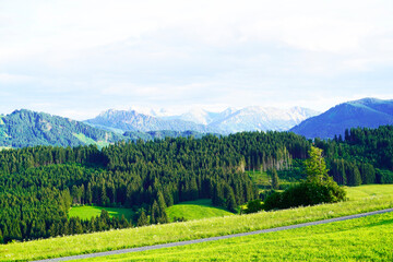 Fototapeta na wymiar Panorama landscape in the Allgäu in Bavaria. Nature with mountains, meadows and forests.