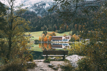 Reflections and autumn colors on Lake Hintersee in southern Germany 