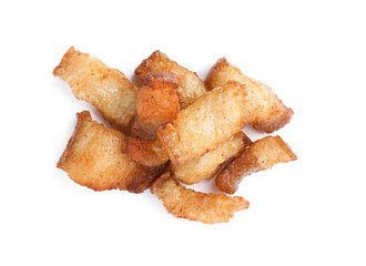 Tasty fried cracklings on white background, top view. Cooked pork lard