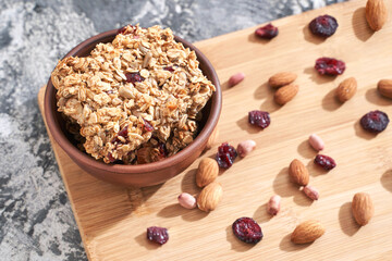 Healthy baking cookies. Oatmeal and honey sweets. Cranberry and nuts energy. Natural raw snack. Tasty cuisine. Vegerarian food. Delicious banana and flake granola