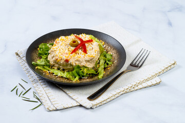 Russian salad in marble table
