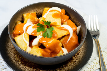 Spicy Potatoes in marble table