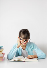 pretty schoolgirl with books. reading a book. elementary education concept. primary school