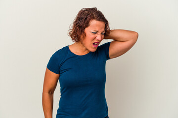 Middle age latin woman isolated on white background having a neck pain due to stress, massaging and touching it with hand.