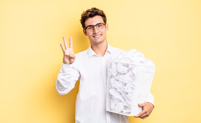 smiling and looking friendly, showing number three or third with hand forward, counting down. trash...