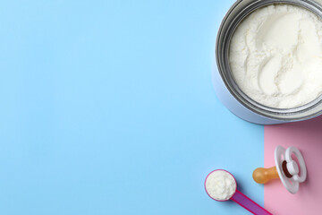 Flat lay composition with powdered infant formula on color background, space for text. Baby milk