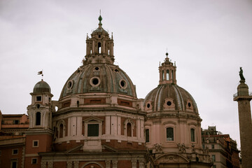 Fototapeta na wymiar Cupolas of Italian churches with a cloudy sky