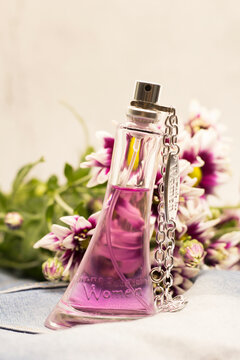 September 13, 2021. Izhevsk, Russia. Women's perfume Bruno Banani and a bouquet of chrysanthemums.