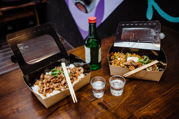 Fototapeta na wymiar two boxes of korean food from the asian urban market