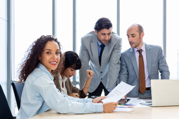 Businesspeople discussing together in the conference room during meeting at the office.