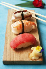 Japanese sushi on blue background