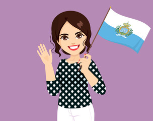 Beautiful brunette woman holding San Marino flag making waving hand gesture
