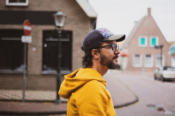Man on the streets of a Dutch town 
 - obrazy, fototapety, plakaty