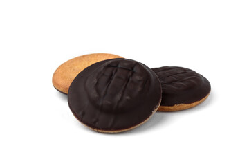 Pile of chocolate biscuit cookies with orange jam isolated on white background.