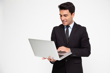 Young business man in suit using laptop computer on hand isolated on white background