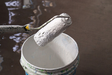 paint brush with paint on pot